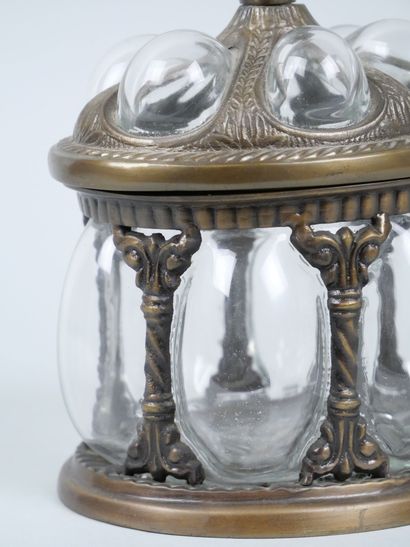 Oval blown-glass and metal cookie tin decorated...