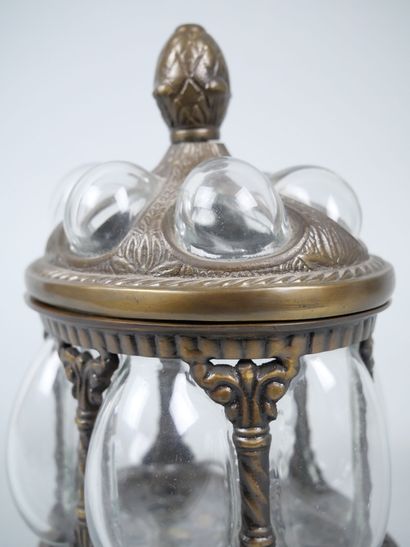 Oval blown-glass and metal cookie tin decorated...