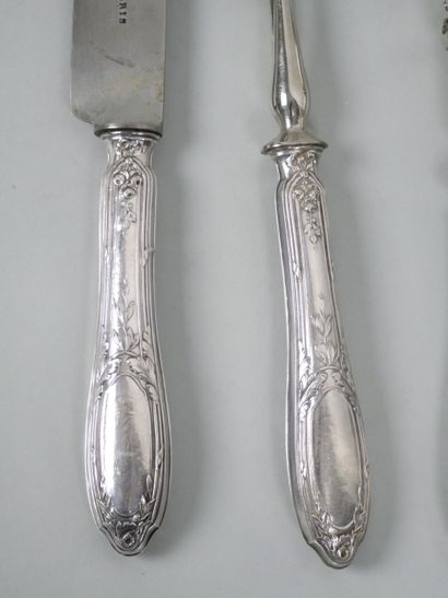 Silver flatware with ribbon and laurel leaf...