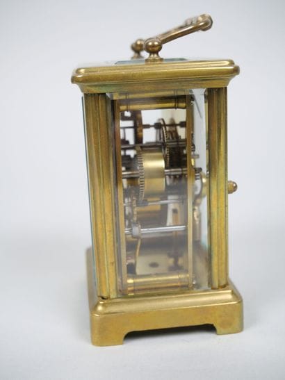 Officer's travel alarm clock with brass cage...