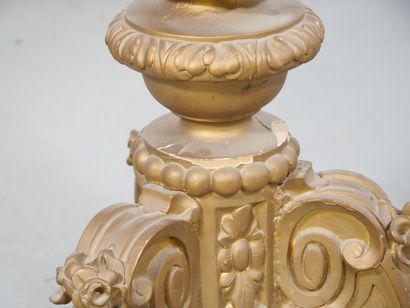Gilded wood pedestal table carved with scrolls...