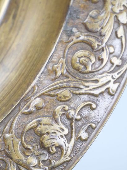 Bronze tripod bowl with relief decoration...