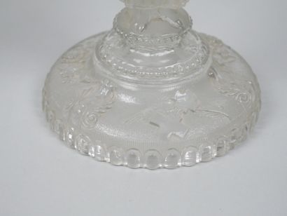 A pair of candlesticks in partially frosted...