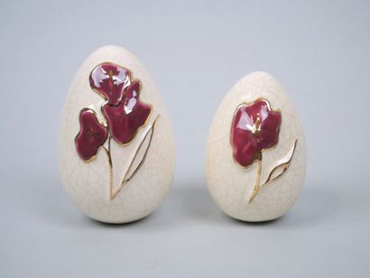 LONGWY
Pair of cracked earthenware eggs decorated...