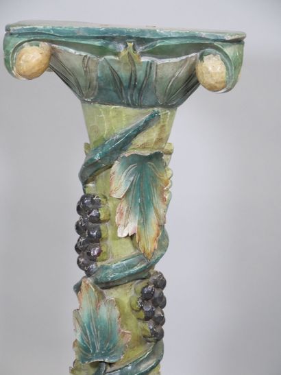 Wooden torso column with polychrome vine...