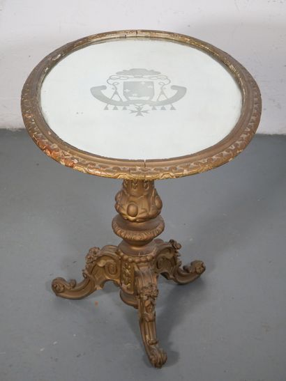 Gilded wood pedestal table carved with scrolls...