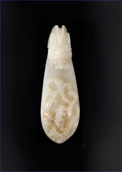 CHINA - 19th century
Celadon and brown-veined...