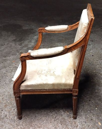 Moulded and carved natural wood armchair...
