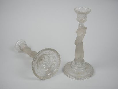 A pair of candlesticks in partially frosted...