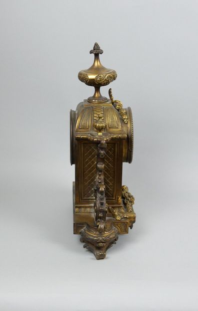 Gilt bronze clock, painted Roman numeral...