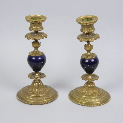 Pair of gilt bronze candlesticks decorated...