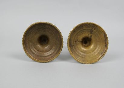 Pair of gilt bronze candlesticks decorated...