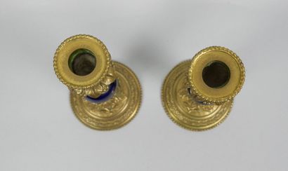 Pair of gilt bronze candlesticks decorated...