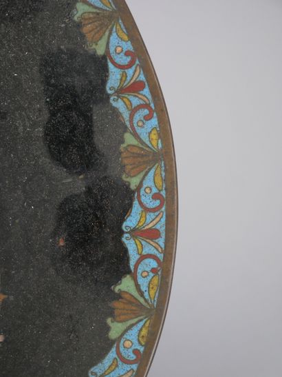 CHINA
Enameled porcelain dish decorated in...