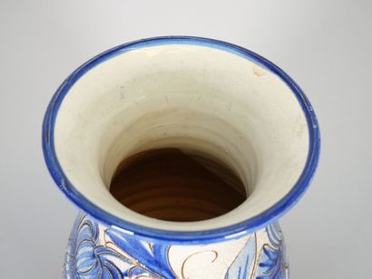 ITALY
An enameled majolica baluster vase...
