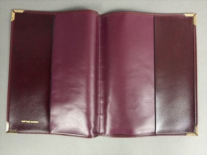 Set of two red leather wallets decorated...