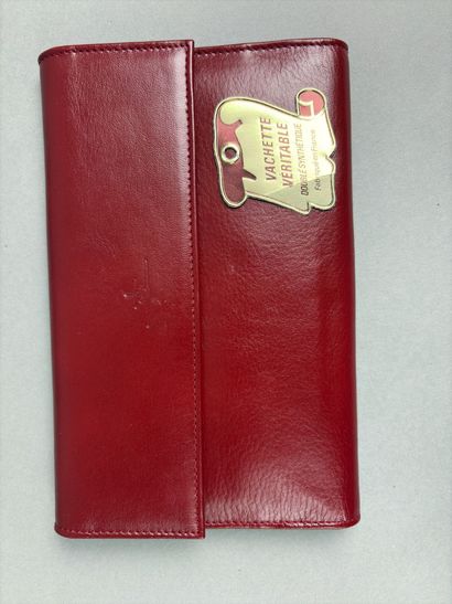 Set of two red leather wallets decorated...
