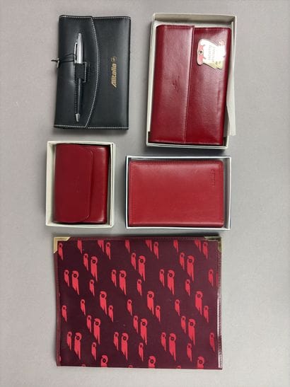 Set of two red leather wallets decorated...