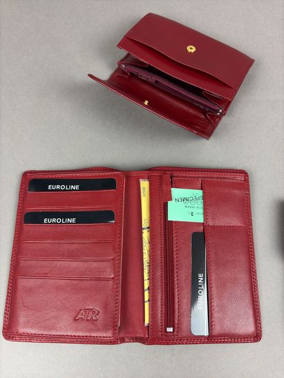 Set of two red leather wallets decorated...