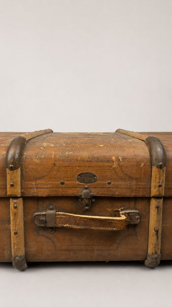 Wooden travel trunk partially lined with...