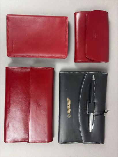 Set of two red leather wallets decorated...