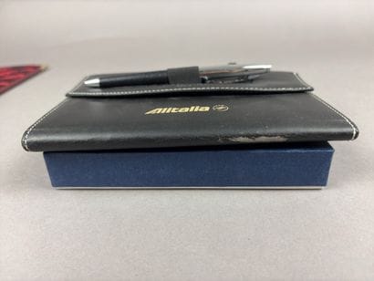 Set of two red leather wallets decorated...