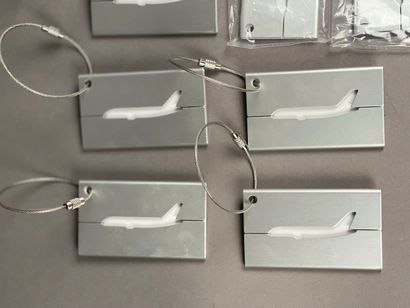 Set of 7 aluminum luggage tags featuring...