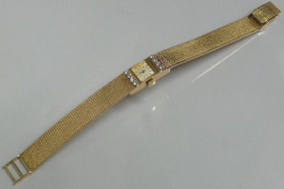 Montre dame en or jaune, bracelet et boitier...