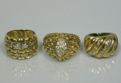 Trois bagues en or jaune pavées de brillants:...