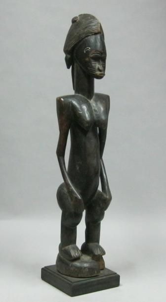 Afrique*
Figure féminine en bois sculpté....