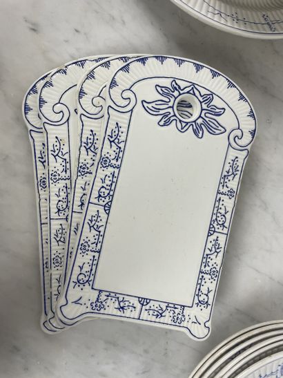 Large earthenware dinner service with blue...
