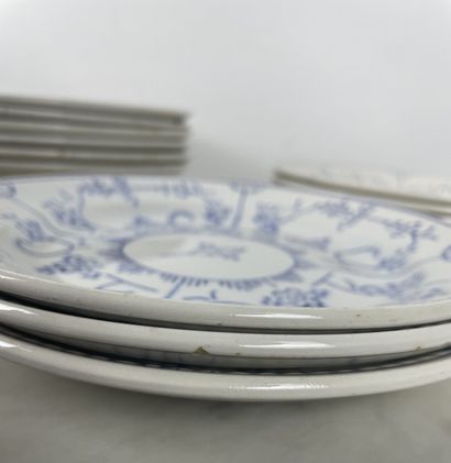 Large earthenware dinner service with blue...