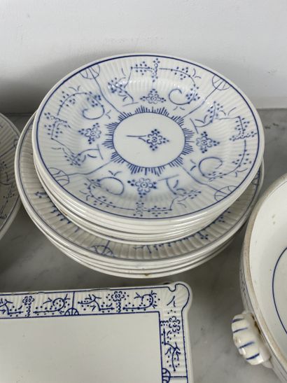 Large earthenware dinner service with blue...