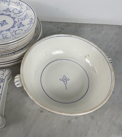 Large earthenware dinner service with blue...