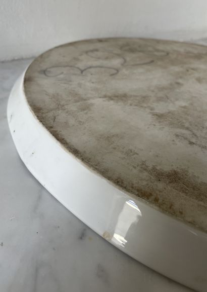 Large glazed earthenware tray, central polychrome...