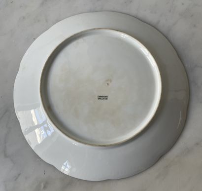 Three decorative plates in hand-painted Limoges...