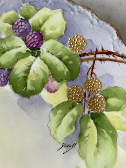 Three decorative plates in hand-painted Limoges...