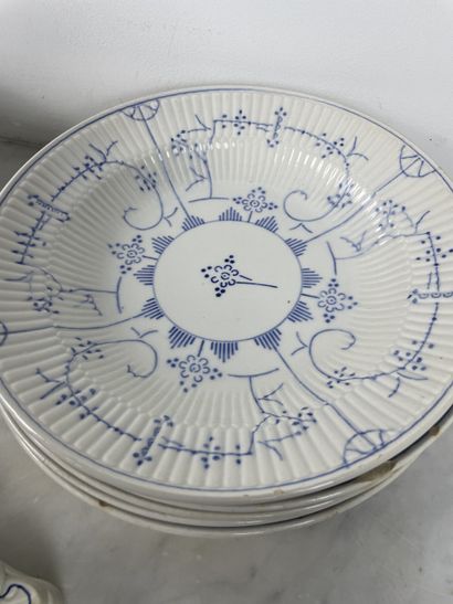 Large earthenware dinner service with blue...