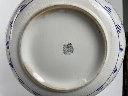 Large earthenware dinner service with blue...