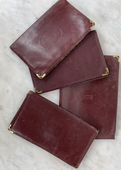 Cartier Lot de quatre pochettes et porte-documents...