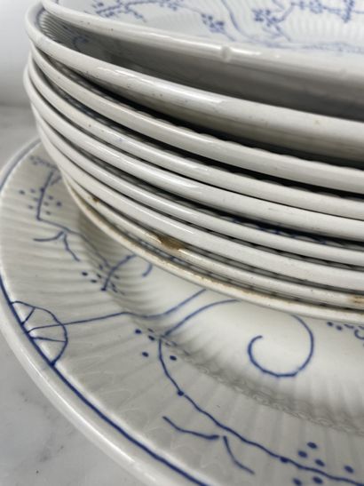 Large earthenware dinner service with blue...