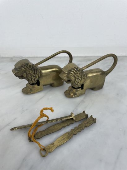 Pair of bronze lion-shaped padlocks with...