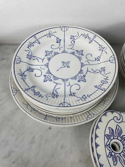 Large earthenware dinner service with blue...