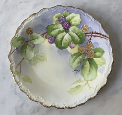 Three decorative plates in hand-painted Limoges...