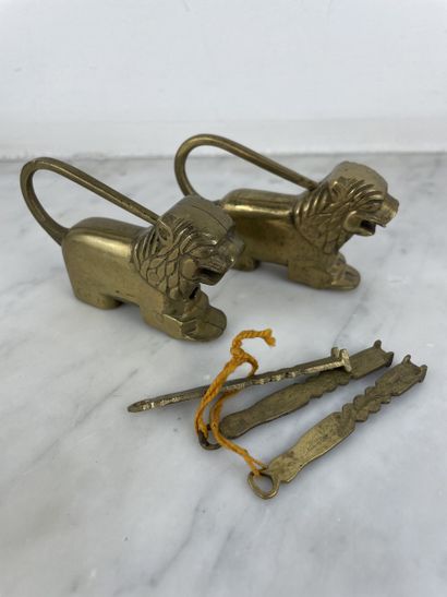 Pair of bronze lion-shaped padlocks with...