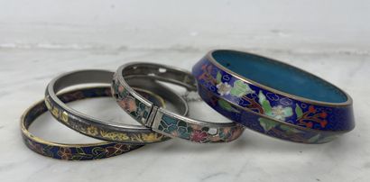 Set of four rigid enameled metal bracelets...