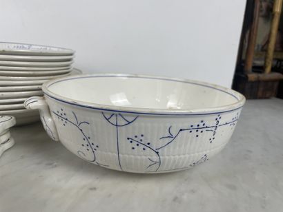 Large earthenware dinner service with blue...