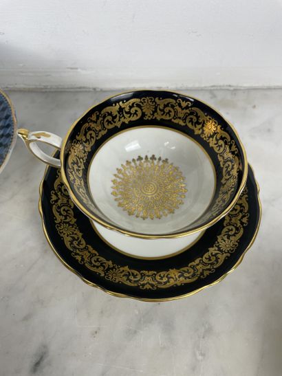 Set of five porcelain cups and saucers, including:...