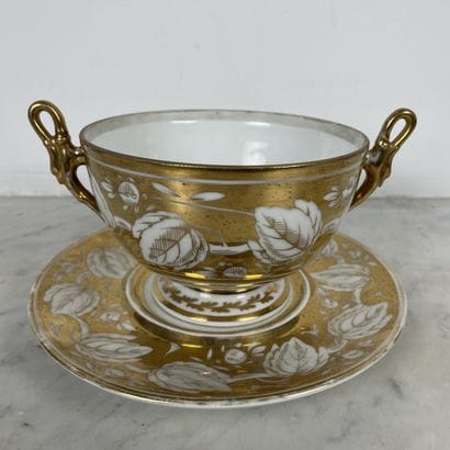 Porcelain two-handled bouillon cup and display...