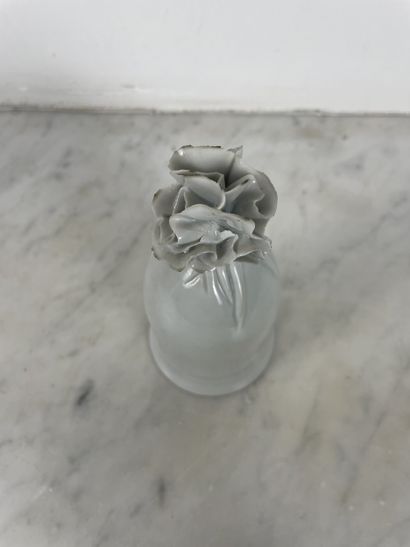Decorative white porcelain bell in the shape...